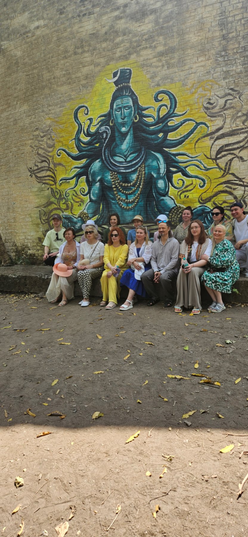 The group in front of a Shiva mural in Rishikesh