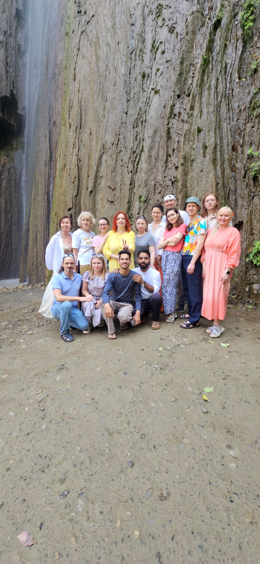 A larger group gathered at the waterfall
